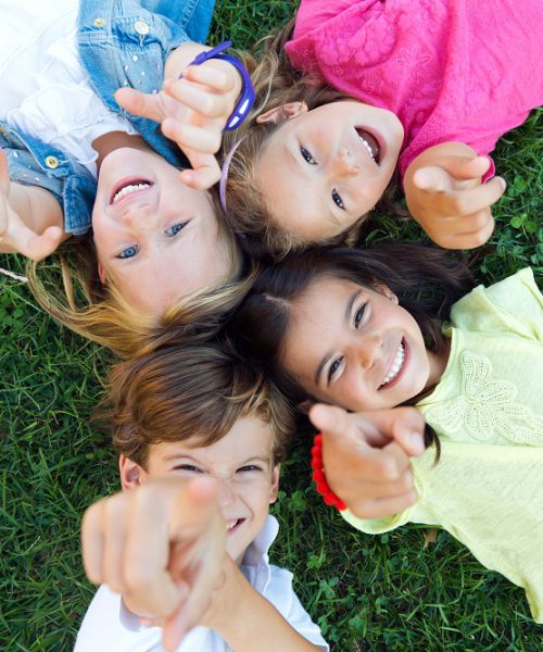 Portrait of group of childrens having fun in the park.